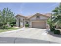 Attractive single-story house with a tile roof and a spacious driveway at 1210 W Betty Elyse Ln, Phoenix, AZ 85023