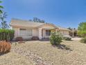 Well-kept front yard with desert landscaping including gravel, boulders, and shrubs at 13431 N 30Th St, Phoenix, AZ 85032