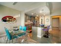 Modern kitchen with sleek countertops and island seating overlooks a dining area at 140 E Rio Salado Pkwy # 1006, Tempe, AZ 85281