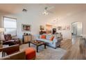 Inviting living room boasts a neutral color palette, ceiling fan, and abundant natural light at 1635 E Harrison St, Chandler, AZ 85225