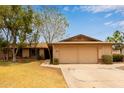 Charming single-story home featuring a two-car garage and mature landscaping in a suburban setting at 1874 E Huntington Dr, Tempe, AZ 85282