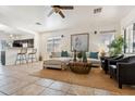 Comfortable living room with a sectional sofa, modern furnishings, and an open floor plan at 21362 E Puesta Del Sol Rd, Queen Creek, AZ 85142