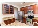 Well-equipped kitchen with granite counters, stainless steel appliances, and ample storage space at 25640 N 108Th Dr, Peoria, AZ 85383