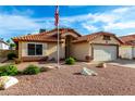 Charming single-story home boasts a desert landscape, neutral stucco, and a tile roof in a well-maintained neighborhood at 3443 E Wickieup Ln, Phoenix, AZ 85050