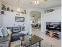 Bright and inviting living room with neutral colors and stylish decor, open to the dining area at 4407 W Avenida Del Sol --, Glendale, AZ 85310