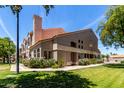 Attractive multi-story home with lush landscaping and well-kept lawn at 500 N Roosevelt Ave # 26, Chandler, AZ 85226