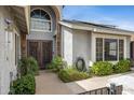 Home featuring a beautifully landscaped front entrance and ornate metal security doors at 5020 E Dallas St, Mesa, AZ 85205