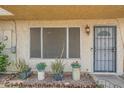 Inviting front entrance with secured door and decorative plants at 6304 N 47Th Ave, Glendale, AZ 85301