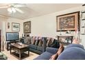 Cozy living room features comfortable seating and neutral walls at 6304 N 47Th Ave, Glendale, AZ 85301