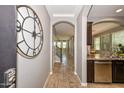 Inviting foyer with tile flooring, arched doorways, and views into the living spaces at 6611 S San Jacinto St, Gilbert, AZ 85298