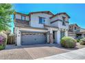 Attractive two-story home boasts stone accents, a two-car garage, and a well-kept brick driveway at 6611 S San Jacinto St, Gilbert, AZ 85298
