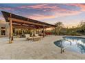 Expansive covered patio with ample seating, ideal for relaxing and enjoying the outdoor living space at 7304 E Bent Tree Dr, Scottsdale, AZ 85266