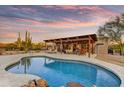 Gorgeous pool and spacious patio area, perfect for outdoor entertaining and enjoying desert sunsets at 7304 E Bent Tree Dr, Scottsdale, AZ 85266