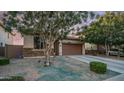 Attractive single-story home with a two-car garage, desert landscaping and cozy curb appeal at 11742 W Chase Ln, Avondale, AZ 85323