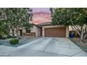 Charming single-story home with a two-car garage, desert landscaping and cozy curb appeal at 11742 W Chase Ln, Avondale, AZ 85323