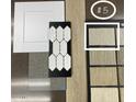 Display of interior upgrade materials including cabinets, flooring, backsplash and carpet samples at 12816 N 172Nd Dr, Surprise, AZ 85388