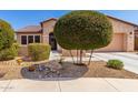 Charming single-Gathering home with manicured landscaping, decorative rock, and inviting curb appeal at 17111 S 180Th Ln, Goodyear, AZ 85338