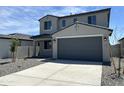 Beautiful two-story home featuring a gray color scheme, well-kept gravel yard, and a spacious two-car garage at 17245 W Corrine Dr, Surprise, AZ 85388