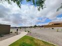 Scenic community area with walking path, desert landscaping and plenty of open space at 19422 N Fiano Dr, Maricopa, AZ 85138