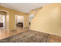 A large, open entryway with tile flooring and a view to the living room at 2526 W Florentine Rd, Phoenix, AZ 85086