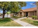 Welcoming home features a well-kept lawn and attractive landscaping at 3491 N Arizona Ave # 118, Chandler, AZ 85225