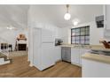 Well-lit kitchen with white cabinetry and modern appliances at 3491 N Arizona Ave # 118, Chandler, AZ 85225