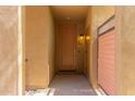 View of the front door with a private entry and a lovely light fixture at 36600 N Cave Creek Rd # C7, Cave Creek, AZ 85331