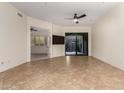 Bright, spacious living room with tile flooring and modern ceiling fan at 36600 N Cave Creek Rd # C7, Cave Creek, AZ 85331