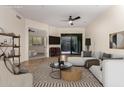 A beautifully staged living room with a neutral color palette and an outdoor view at 36600 N Cave Creek Rd # C7, Cave Creek, AZ 85331