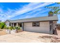 Charming single story home featuring beautiful landscaping and a spacious front yard, with a large driveway at 4028 W El Camino Dr, Phoenix, AZ 85051
