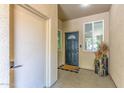 Inviting entryway with stylish decor, a decorative front door, and a welcoming 