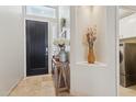 Welcoming entryway with tile flooring, decorative niche, and convenient access to the laundry at 4515 E Casey Ln, Cave Creek, AZ 85331