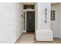 Inviting front entrance with a secure door, stylish lighting, and clear address display at 4515 E Casey Ln, Cave Creek, AZ 85331
