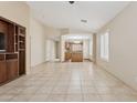 Spacious living room with neutral tile flooring and a built-in entertainment center at 4718 E Woburn Ln, Cave Creek, AZ 85331
