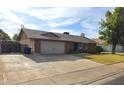 A well maintained single story home with brick facade, two car garage, and spacious driveway at 664 N Glenview --, Mesa, AZ 85213