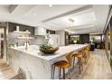 Gourmet kitchen with marble countertops, modern appliances, and a spacious island with seating at 7167 E Rancho Vista Dr # 5001, Scottsdale, AZ 85251