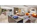 Open-concept living room with modern furnishings, flowing into a kitchen and dining area at 7167 E Rancho Vista Dr # 5001, Scottsdale, AZ 85251