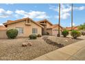 Charming single-story home featuring a neutral color palette, tile roof, and rock landscaping at 8913 S Forest Ave, Tempe, AZ 85284