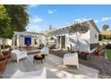 Inviting backyard with modern outdoor seating, fire pit, and lush landscaping at 905 E Coronado Rd, Phoenix, AZ 85006