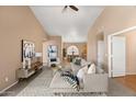 Open concept living room showcases high ceilings, neutral decor, tile floors, and comfortable seating arrangements at 93 S Sandstone St, Gilbert, AZ 85296