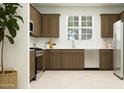 Modern kitchen with stainless steel appliances, stylish cabinets, and bright natural light at 9739 W Catalina Dr, Phoenix, AZ 85037