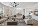 Inviting living room showcasing modern furniture and a view of the dining and kitchen areas at 1029 E Ian Dr, Phoenix, AZ 85042