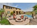 Enjoy outdoor living with a fire pit, swimming pool, and covered patio for year-round enjoyment at 11150 S Star Ct, Goodyear, AZ 85338