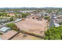 Aerial view of a cleared lot with neighborhood homes, landscaping, ready for new construction at 1137 E 5Th Ave, Mesa, AZ 85204