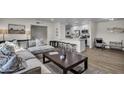 Open concept living room with modern furnishings, seamlessly connected to the kitchen and dining areas at 1142 E Westchester Dr, Tempe, AZ 85283