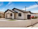 Quaint single-story home with white stucco wall, offering privacy and curb appeal at 1501 E Sheridan St, Phoenix, AZ 85006