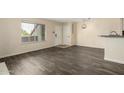 Bright living room with wood floors, natural light, and fresh paint at 1645 W Baseline Rd # 2098, Mesa, AZ 85202