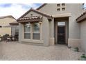 Inviting front entrance with brick paved sitting area at 16514 W Sandia Park Dr, Surprise, AZ 85374