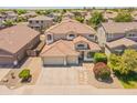Beautiful two-story home with a three-car garage, well-kept landscaping, and a tiled roof in a friendly neighborhood at 2102 S Sabrina --, Mesa, AZ 85209