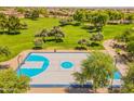 Scenic aerial view of a community basketball court surrounded by lush greenery and mature trees in a park at 2102 S Sabrina --, Mesa, AZ 85209